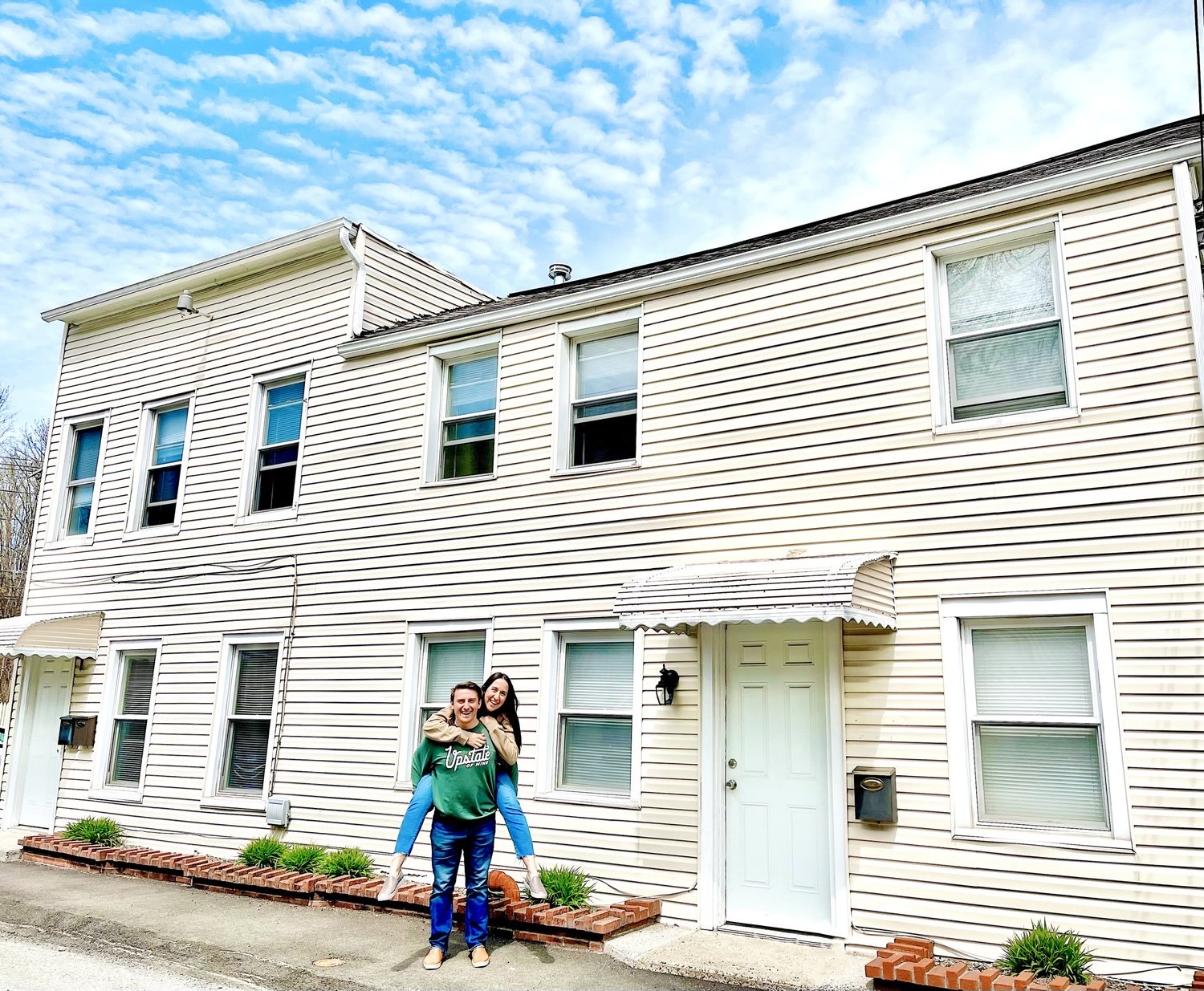 Ali and Josh outside one of their real estate properties